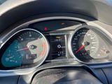 a close up of a car dashboard with a speedometer and gauges