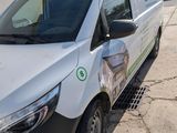 a van that is parked on the side of the street