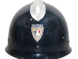 a police helmet that is on display on a white background