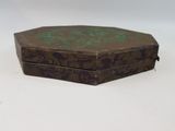 a small wooden box with a green design on it