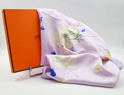 purple scarf with orange book and orange box on white background
