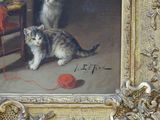 a painting of two cats playing with a ball of yarn