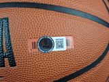 a close up of a basketball with a qr code on it