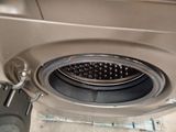 an image of a washing machine with a basket inside of it