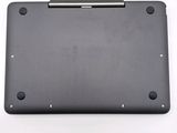 the back side of a laptop with a pen resting on top of it