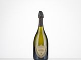 a bottle of champagne sitting on top of a table