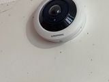 two cameras mounted on the wall next to each other