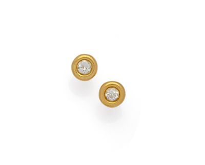 a pair of yellow gold and diamond earrings