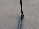 a scooter that is sitting on the pavement