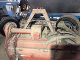 an image of a tractor with a chain attached to it ' s back