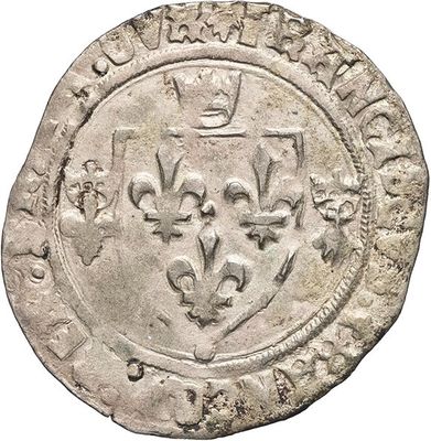 a close up of a coin with a crown on it