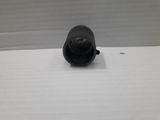a black object that is sitting on a white surface