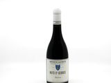 a bottle of wine that is sitting on a table