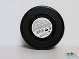 a close up of a black object on a white surface