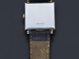 an image of a close up of a watch on a black surface