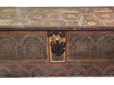 an old wooden box with ornate designs on the inside