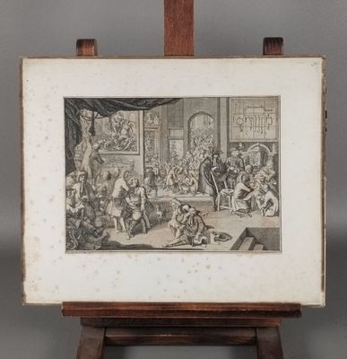 une vieille photo d'un groupe de personnes assises autour d'une table