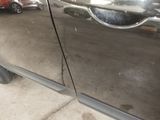 a close up of a car door with a handle on it