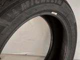 a close up of a tire on a white surface