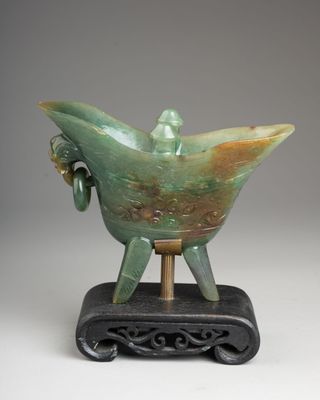 an image of a sculpture of a bird on a stand