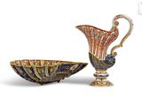 two vases and a bowl sitting next to each other