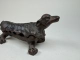 a small dog statue sitting on top of a table