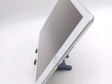a tablet that is sitting on a stand on a table