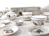 a table that has a lot of dishes and cups on it