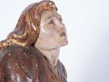 statue of a woman holding a bird in her hand