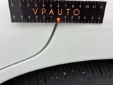 a close up of a measuring tape on the side of a car