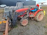 a tractor that is parked on the side of the road