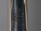 a close up of a silver spoon with a black handle