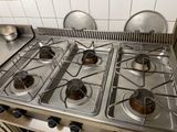 four burners on the stove in the kitchen