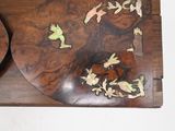 a picture of a wooden table with flowers on it