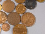 a lot of coins that are laying on a table