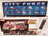 a box with a picture of a fire truck and a remote control