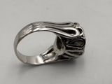 sterling silver ring with black stones on a white background