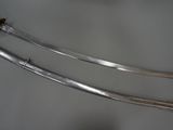 two swords that are on display on a table