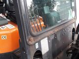 a close up of a tractor with the door open