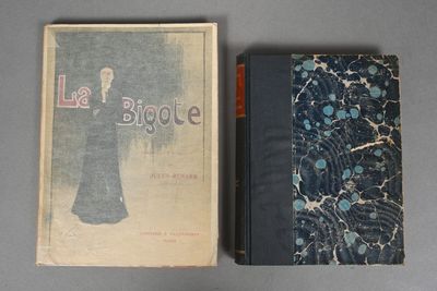 two books sitting on top of a table next to each other