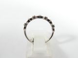 a close up of a ring on a stand with a white background