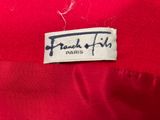 the label on the back of a red jacket