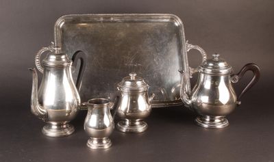 a silver tray with a silver tea set on it