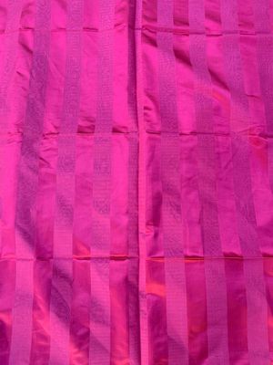 a close up of a pink fabric with stripes on it