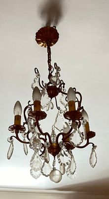 a chandelier hanging from the ceiling in a room