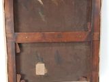 an old picture of a wooden frame with a piece of paper on it