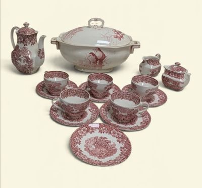 un service de table rouge et blanc comprenant un bol, des tasses, des soucoupes et des soucoupes