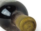 a bottle of wine that is sitting on a table