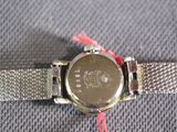 an image of a close up of a wrist watch on a table