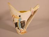 a vase with a picture of a man riding a horse